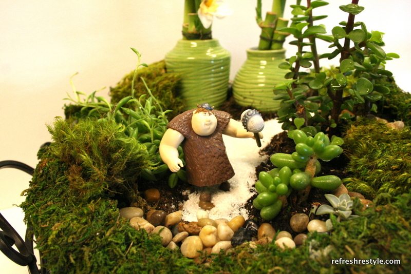 Add fun mini characters to create a fun miniature garden.