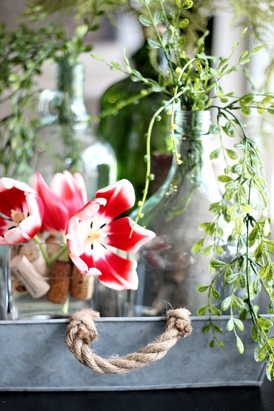 Fresh tulips and recycled wine bottles
