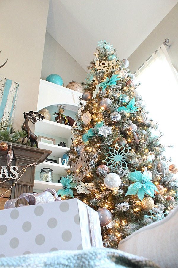 Copper, silver and grays really make the turquoise pop on this snowy Christmas Tree!