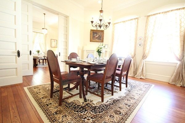 Dining Room at Southern Romance Phantom Screen Idea Home in Mobile Al