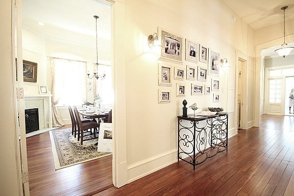 Hall way at the Southern Romance home - pictures frames were made from molding rescued from the makeover