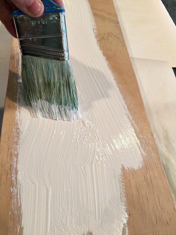 Paint your board with craft paint or chalk paint let it dry and create your farmhouse sign